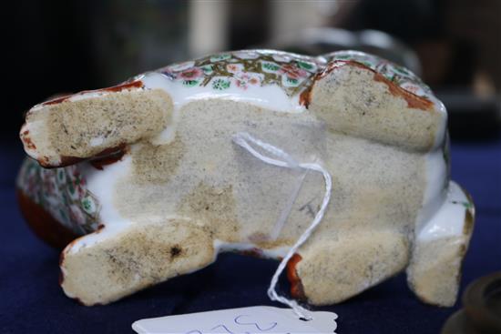 A Japanese Kutani porcelain lion dog candlestick, enamelled and gilt decoration and a Canton vase candlestick height 10cm